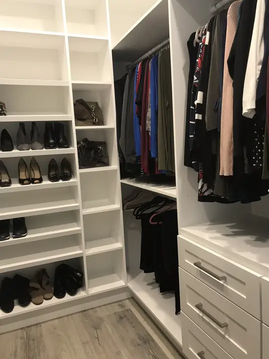 Custom closet system with hanging, shelves and drawers