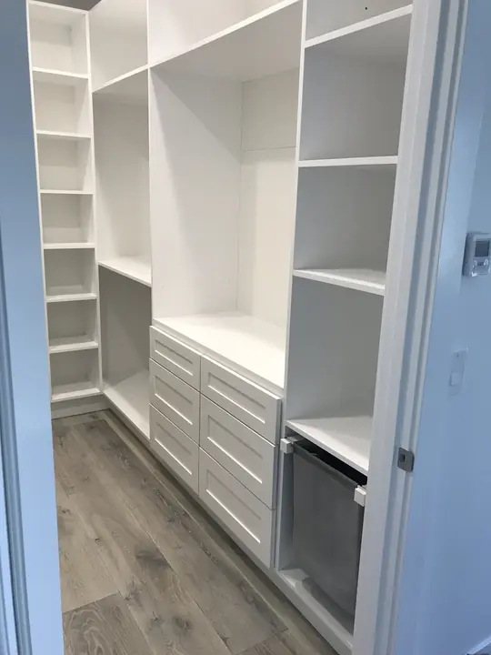 Closet system with built-in drawers and pull-out hamper