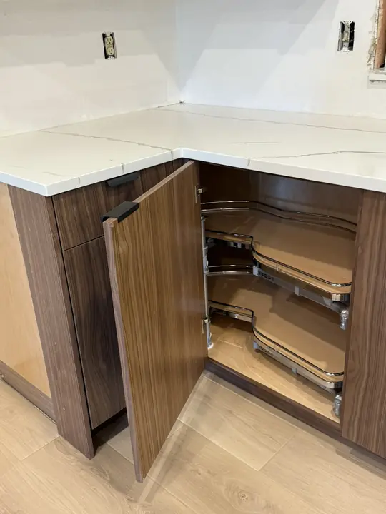 Walnut corner cabinet with pull-out organizers