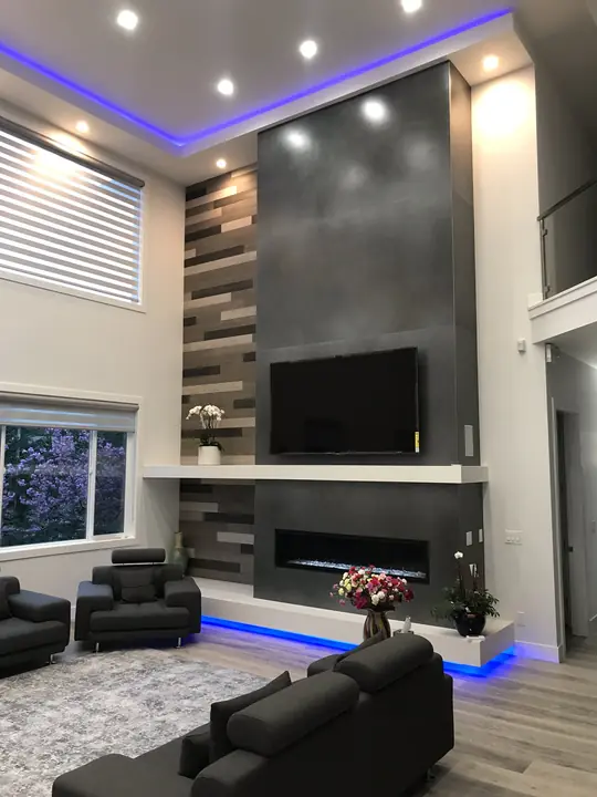 Double-height feature wall with fireplace and wood accent