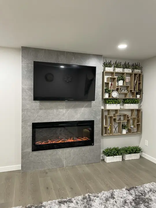 Tiled fireplace wall with TV and display shelving