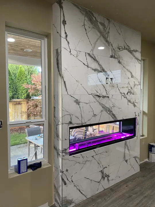 Floor-to-ceiling marble fireplace surround