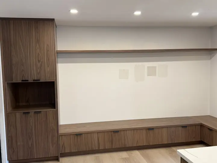 Walnut built-in wall unit with bench seating