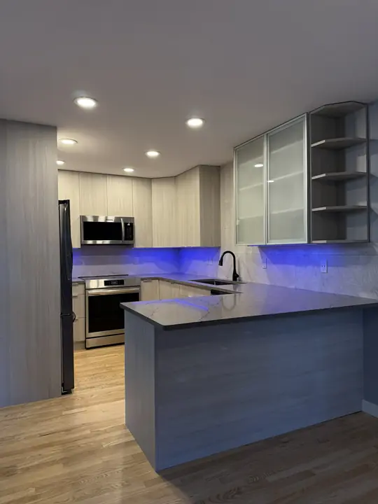 Modern kitchen with glass uppers and LED accent lighting