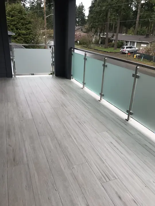 Tiled balcony with frosted glass railing
