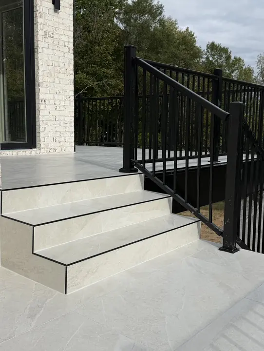 Tiled outdoor steps with metal nosing and railing