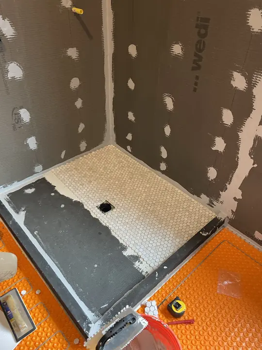 Schluter Kerdi shower pan and sealed wall boards