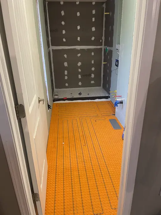 Wedi shower and DITRA-HEAT floor ready for tile