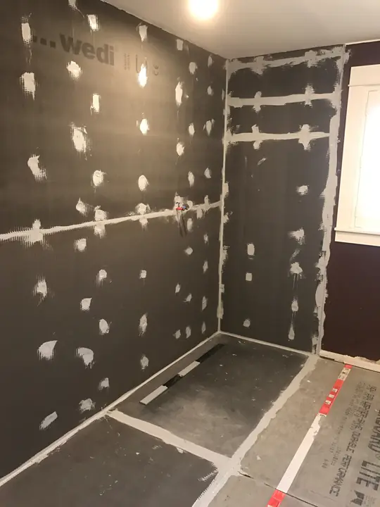Wedi board walk-in shower sealed before tile
